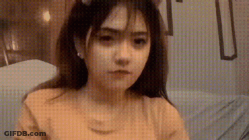 Girl In Cat Ear Headband And Yellow Shirt GIF