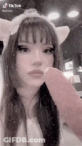 Girl In Cat Ears Headband Holding Pink Ice Cream GIF
