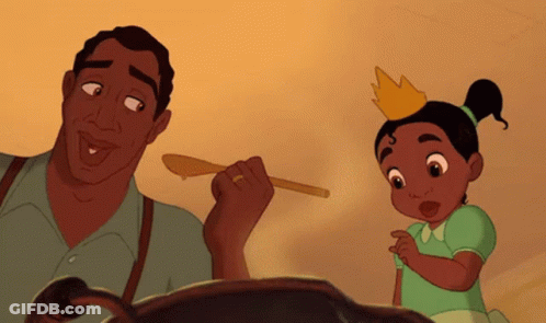 Girl In Crown Beside Man With Wooden Spoon GIF