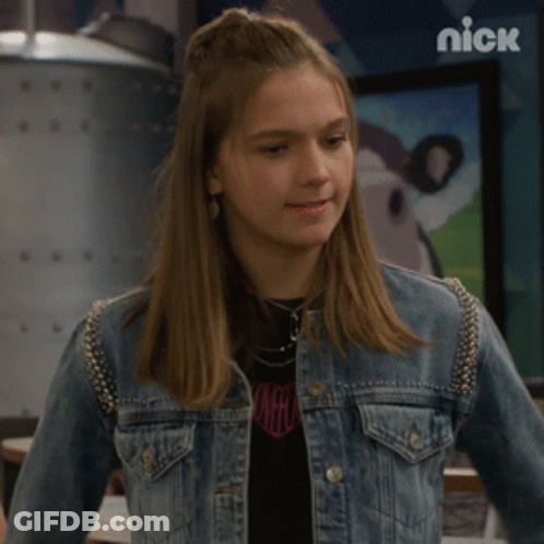 Girl In Denim Jacket And Pink Heart Shirt GIF