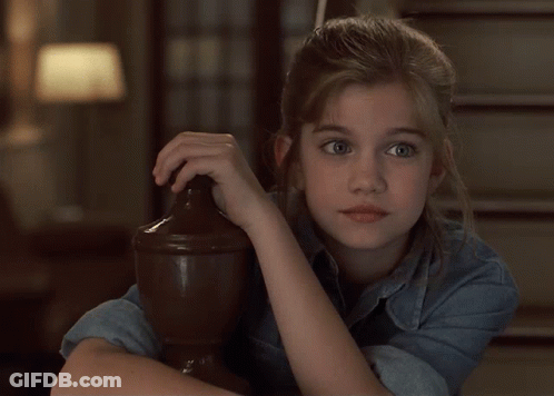 Girl In Denim Shirt Leaning On Wooden Pillar GIF