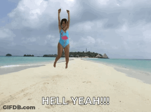 Girl In Flamingo Swimsuit Jumping Beach GIF