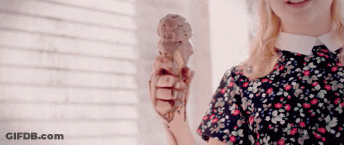 Girl In Floral Dress Holding Ice Cream Cone GIF