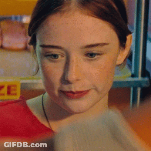 Girl In Front Of Yellow Prize Sign GIF