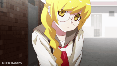 Girl In Glasses And Red Tie In Front Of Brick Building GIF
