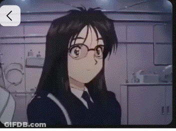Girl In Glasses And Suit Looking At Camera GIF