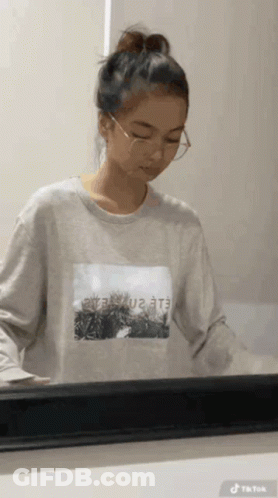Girl In Glasses And Sweatshirt Saying Eee GIF