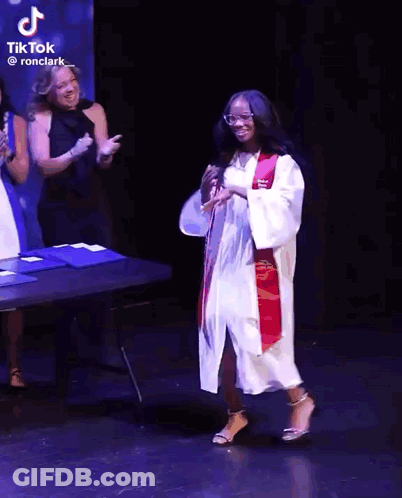 Girl In Graduation Cap And Gown Dancing GIF