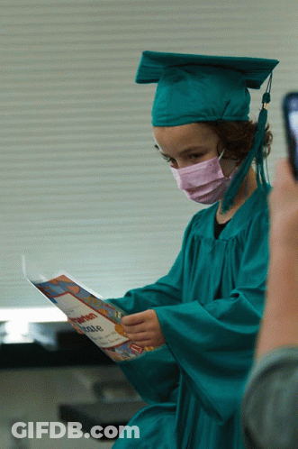 Girl In Graduation Cap And Gown Holding Certificate GIF