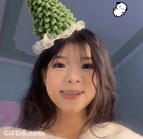 Girl In Green Hat With White Ruffle GIF