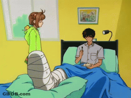 Girl In Green Hoodie Next To Boy In Bed GIF