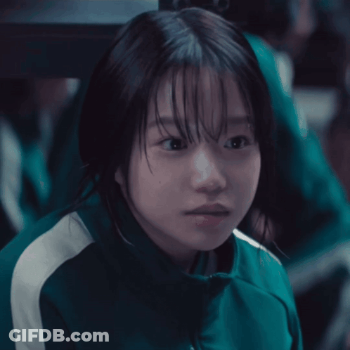 Girl In Green Jacket With White Stripes GIF