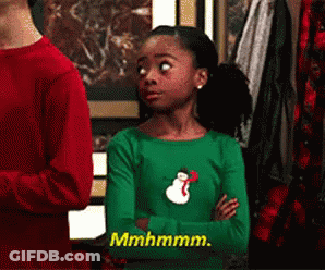 Girl In Green Shirt With Snowman Saying Mhmmm GIF