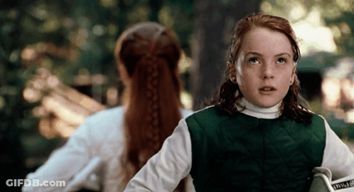 Girl In Green Vest Holding Book Saying Inside GIF