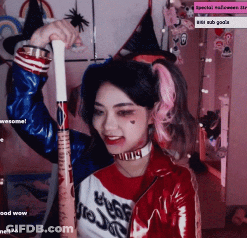 Girl In Harley Quinn Costume Holding Bat GIF