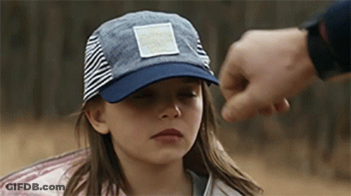 Girl In Hat Held By Man's Hand GIF