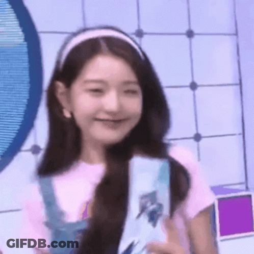 Girl In Headband And Overalls Smiling GIF