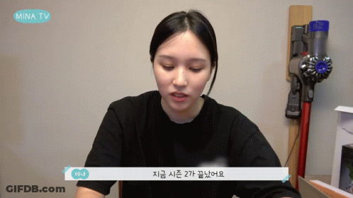Girl In Headphones At Microphone Looking At Camera GIF