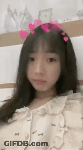 Girl In Heart Headband Laying On Bed GIF