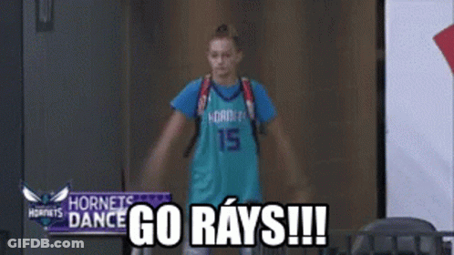 Girl In Hornets Jersey In Hallway GIF