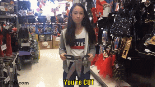 Girl In Levis Shirt Holding Scissors In Store GIF