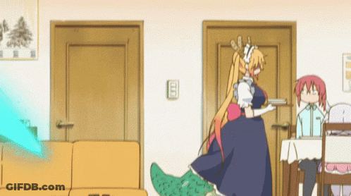 Girl In Maid Outfit Standing Next To Couch GIF