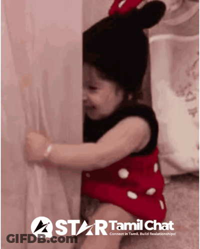Girl In Minnie Mouse Outfit Behind Wall GIF