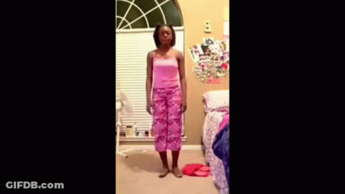 Girl In Pink Dress Dancing In Front Of Window GIF