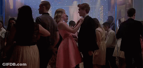 Girl In Pink Dress Dancing With Boy In Black Suit GIF
