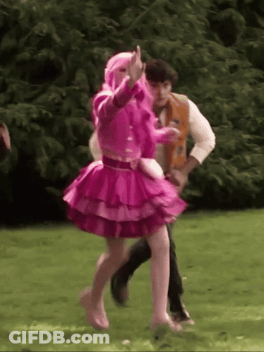 Girl In Pink Dress Dancing With Man In Varsity Jacket GIF