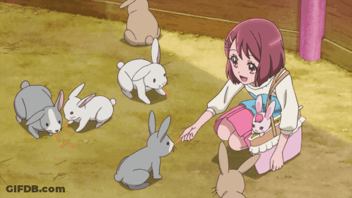 Girl In Pink Dress Feeding Rabbits GIF