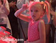 Girl In Pink Dress Holding Stick GIF