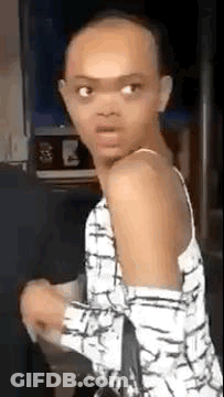 Girl In Pink Dress On Green Inner Tube In River GIF