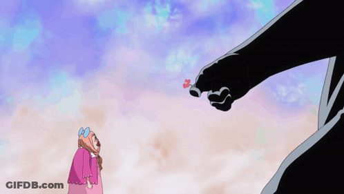Girl In Pink Dress With Blue Bow And Giant Hand With Red Heart GIF
