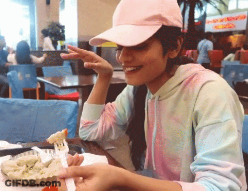 Girl In Pink Hat Eating Food GIF