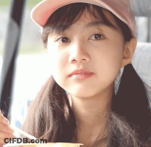 Girl In Pink Hat Holding Spoon GIF