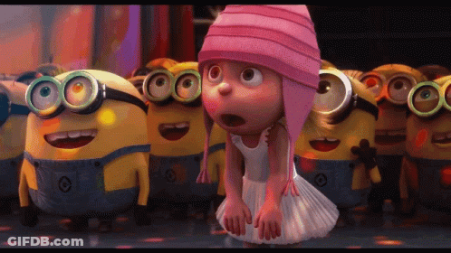 Girl In Pink Hat Surrounded By Minions GIF