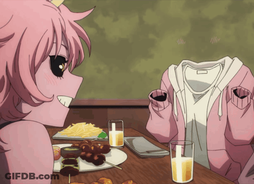 Girl In Pink Hoodie Sitting At Table With Food GIF