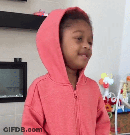 Girl In Pink Hoodie Standing In Room GIF