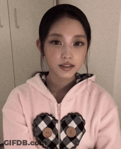 Girl In Pink Jacket With Heart GIF