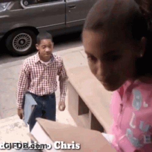 Girl In Pink Shirt Looking At Boy In Plaid Shirt Do Odeia O Chris GIF