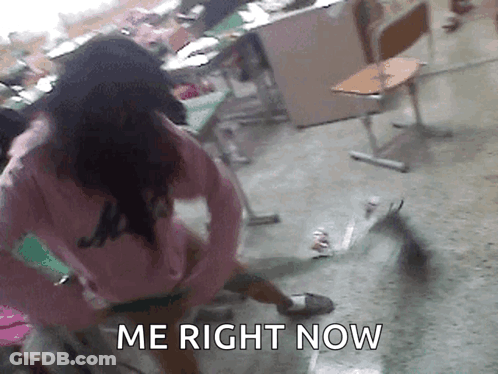 Girl In Pink Shirt Standing In Classroom Saying Me Right Now GIF