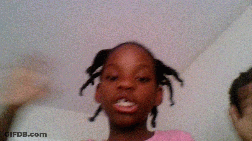 Girl In Pink Shirt With Braids GIF