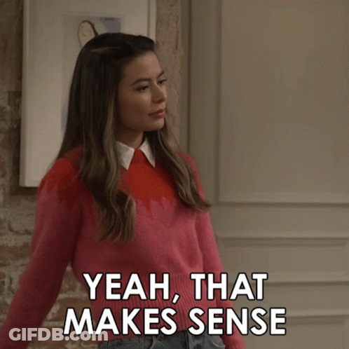 Girl In Pink Sweater Pointing Yeah That Makes Sense GIF