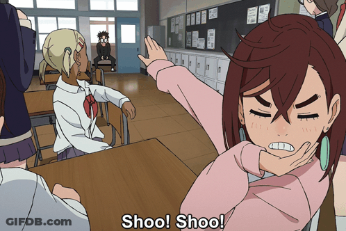 Girl In Pink Sweater Saying Shoo GIF