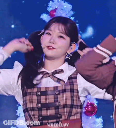Girl In Plaid Dress Holding Pigtails GIF