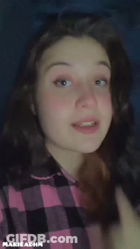 Girl In Plaid Shirt Saying Eat Rice GIF