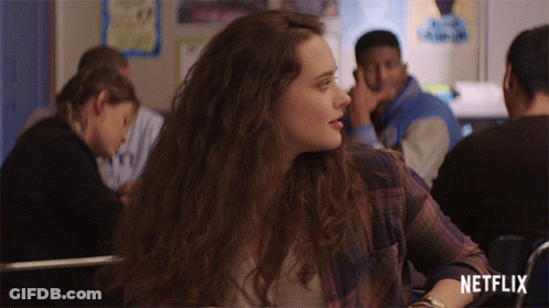 Girl In Plaid Shirt Sits In Classroom With Netflix Logo GIF
