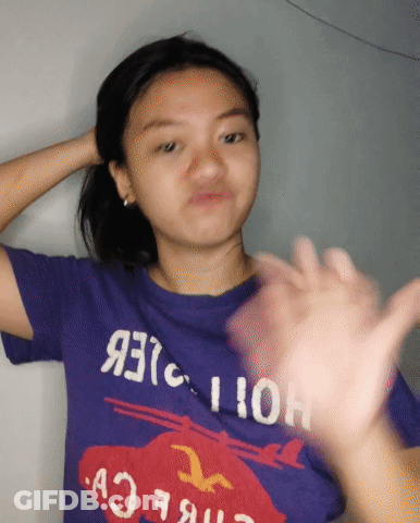 Girl In Purple Hollister T-Shirt Making Funny Face GIF