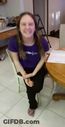 Girl In Purple Shirt Sitting On White Chair GIF
